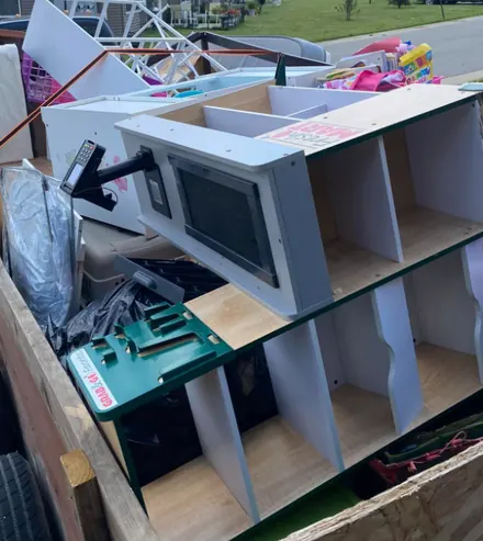 Kids' play stand and toys loaded in a trailer